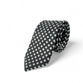Corbata negra con patrón geométrico en blanco